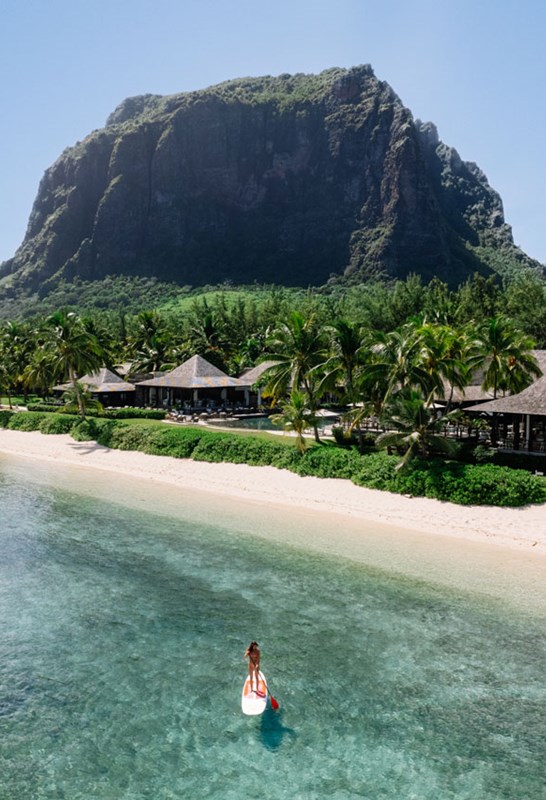 Aerial shot of LUX* Le Morne - Woman on Stand Up Paddle