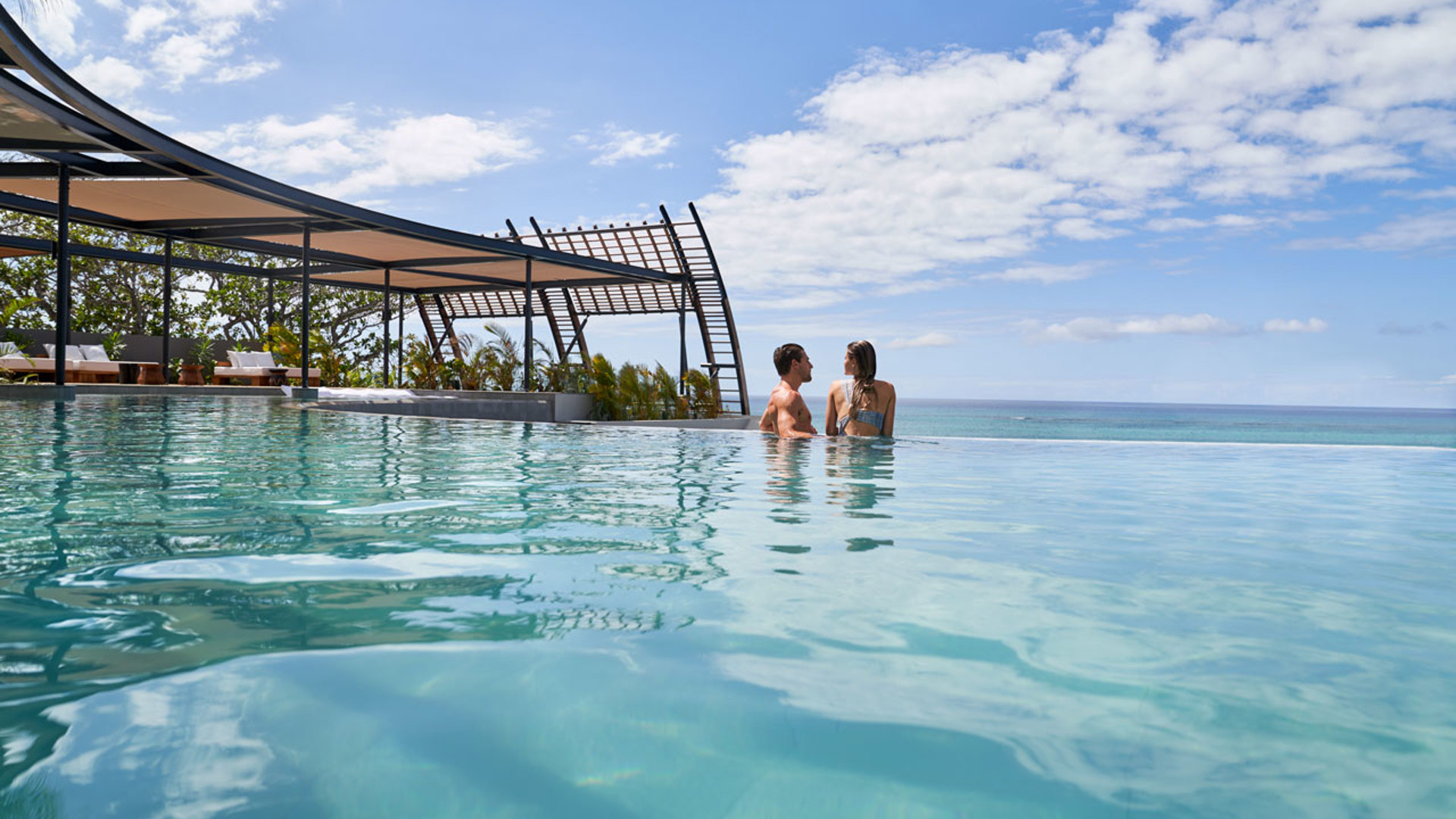 Couple in pool at Bisou, LUX* Grand Baie