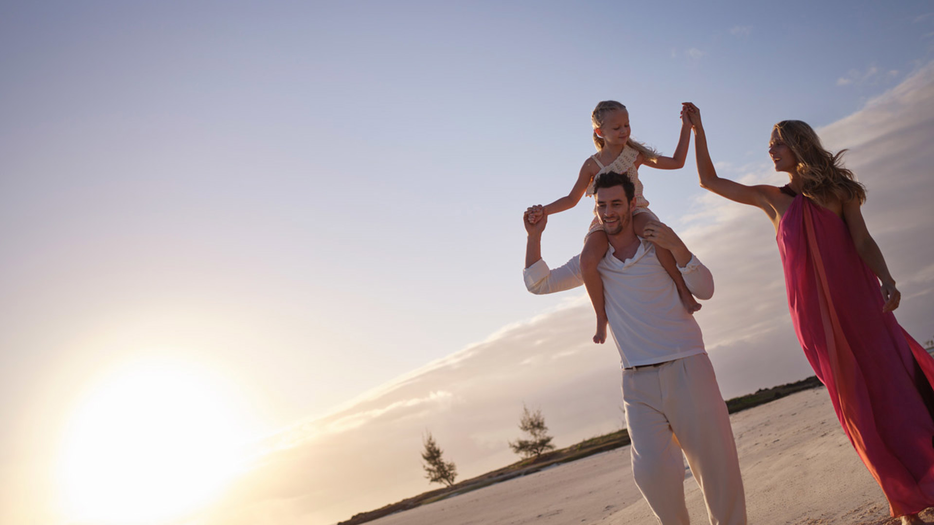 Family enjoying their vacation at LUX* Belle Mare