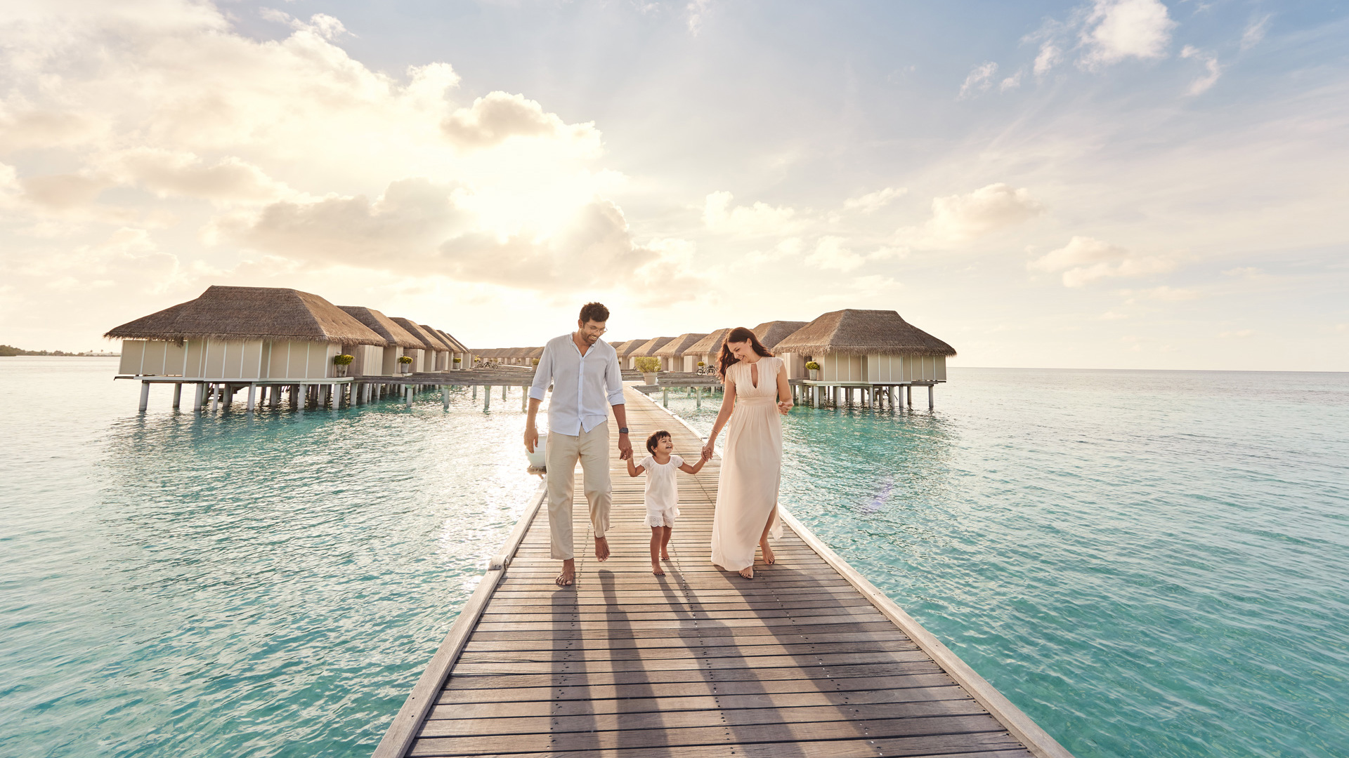 Family on jetty, LUX* South Ari Atoll