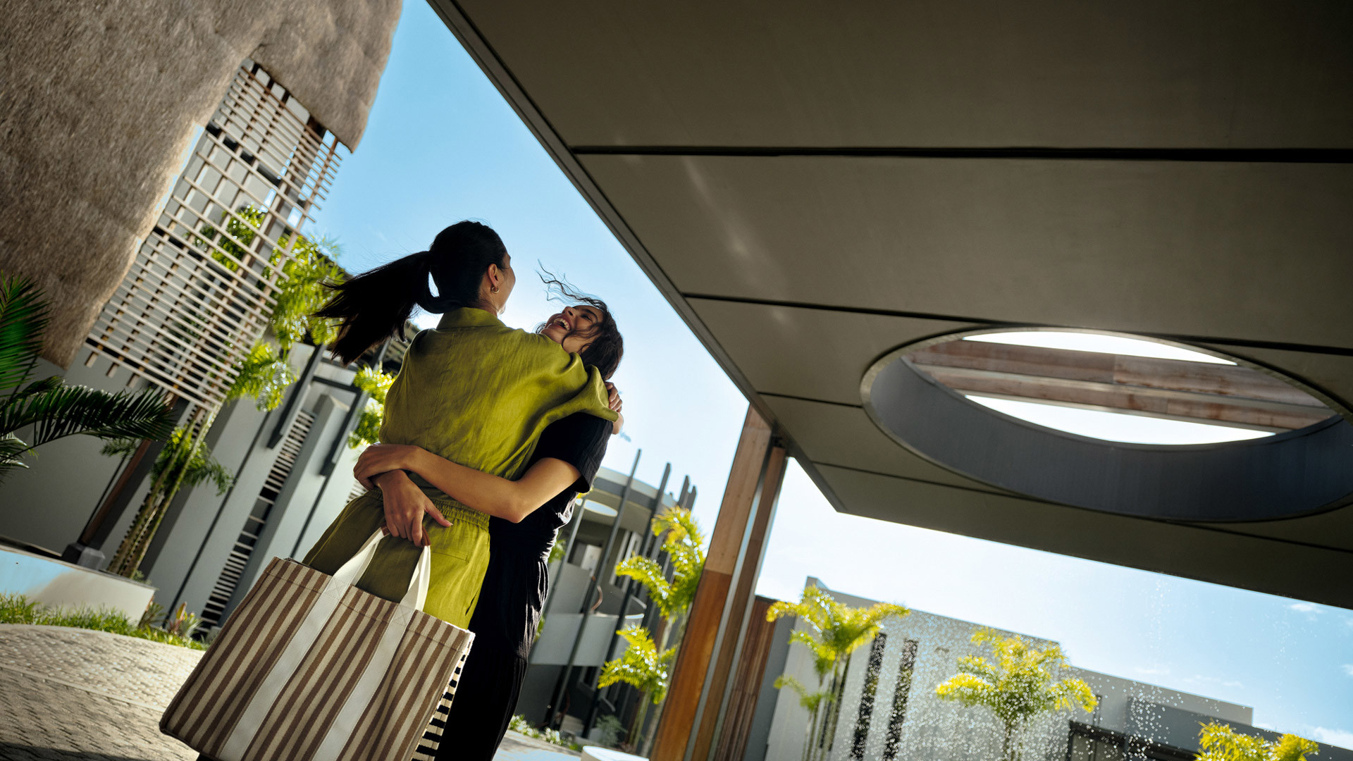 2 women hugging at LUX* Grand Baie
