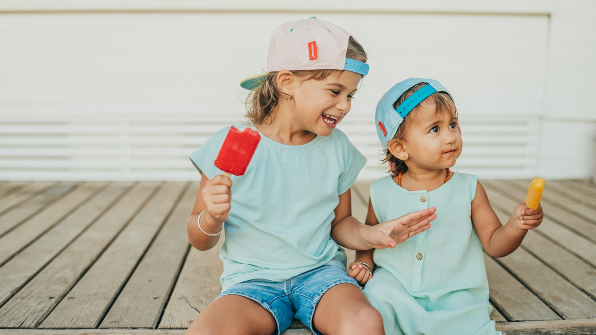 Kids enjoying their popsicle at ICI, LUX* Belle Mare
